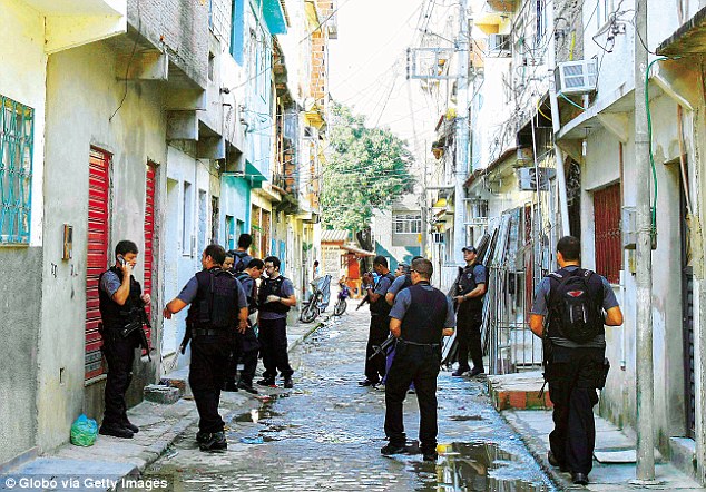 Police raid the New Holland favela in May 2010 - six people were killed